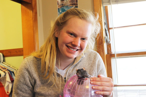 from learning to love. Lexi Scharmer (‘16) poses with her rat, Stella.