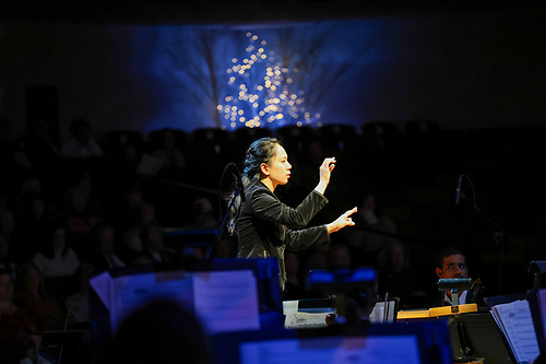 Assistant Professor of Music Adrianna Tam conducting during Christmas at Luther 2023. Photo courtesy of Hans Harelimana Hirwa ('25).