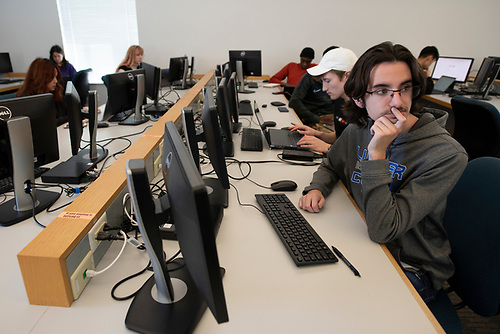 Keagan Larson ('25) utilizes a campus computer for class. Photo courtesy of Luther College. Photographer: Kent Kriegshauser.